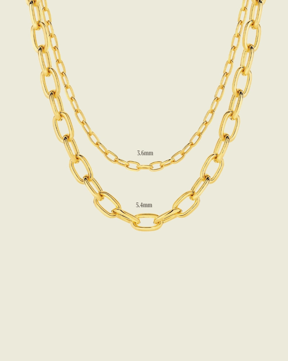 Gold chain necklace on a beige background