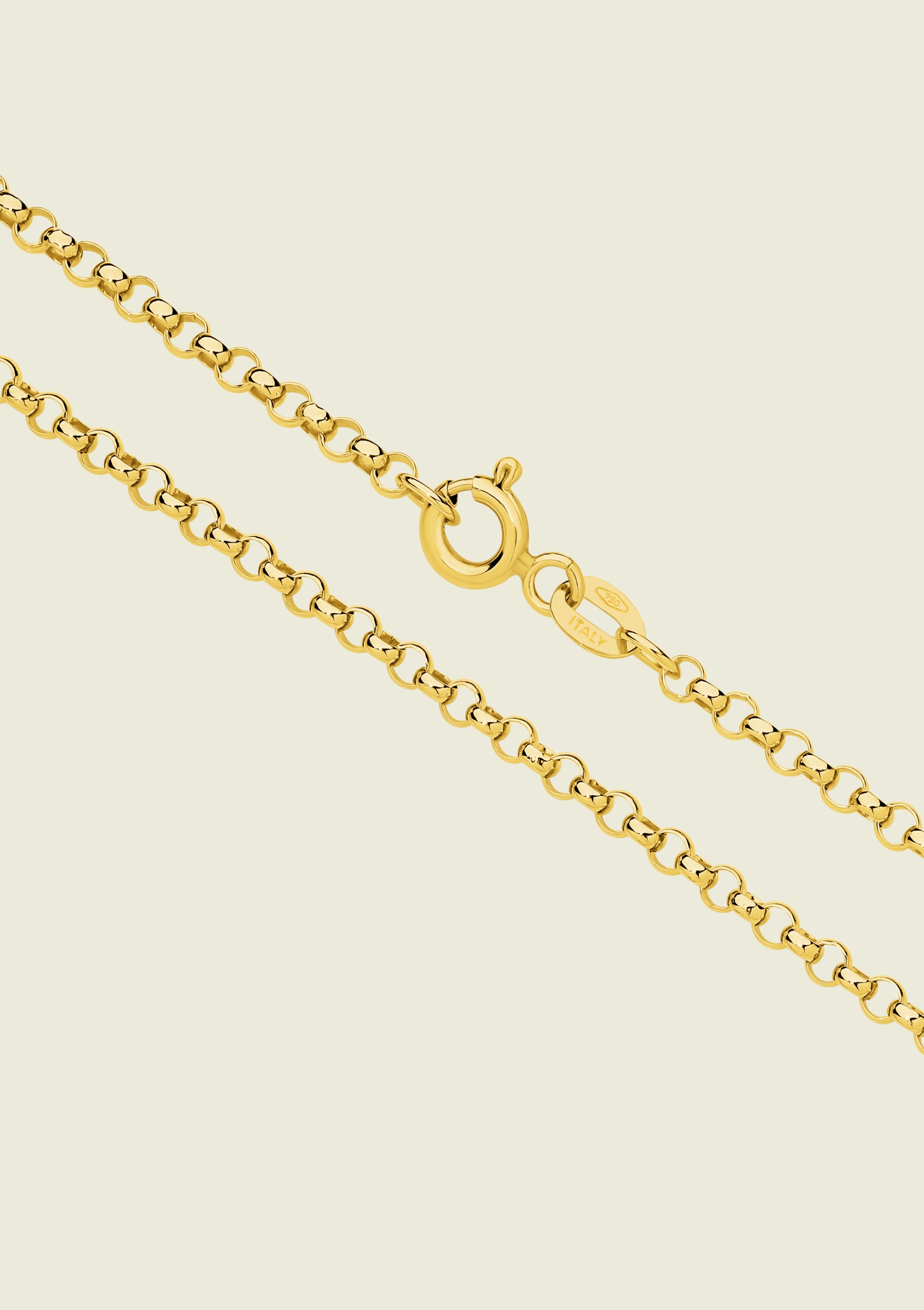 Solid 9k Yellow Gold chain necklace on a beige background