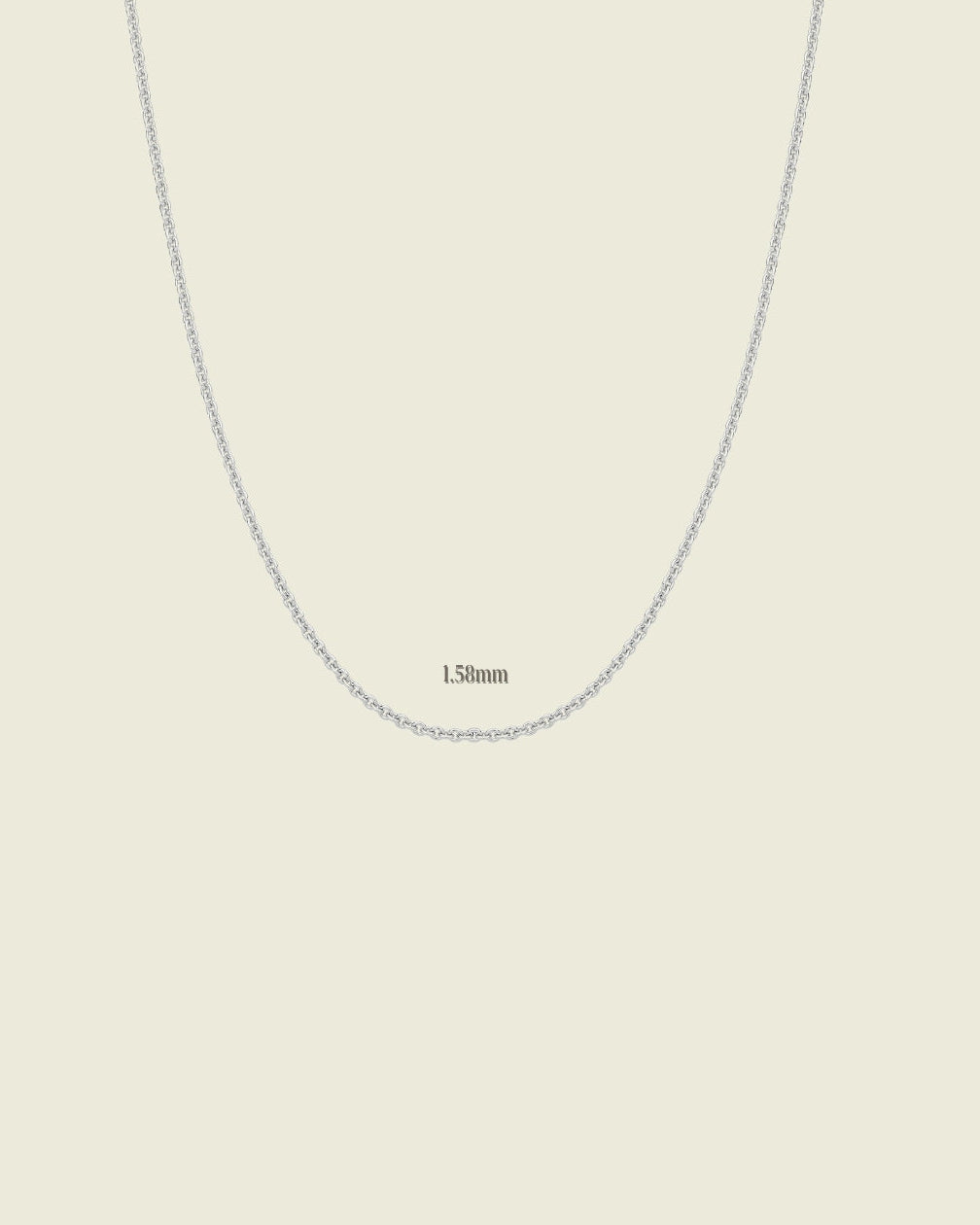 Silver chain necklace on a beige background