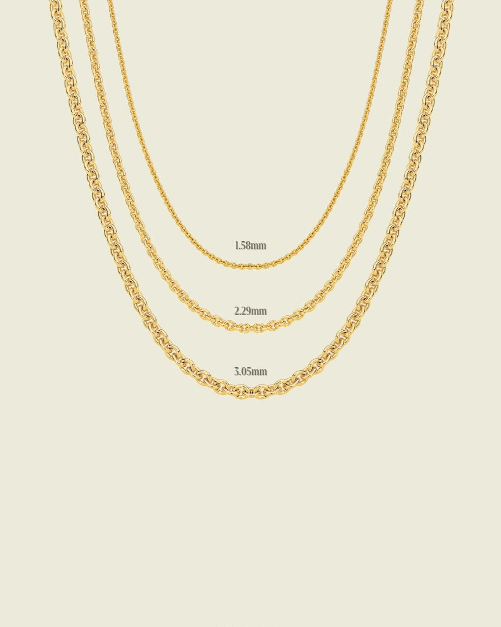 Gold chain necklace on a beige background